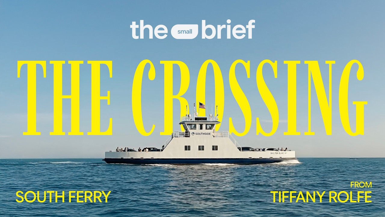 《The Crossing》官方视频海报：白色 South Ferry 渡轮航行在海上，背景为黄色英文片名。